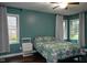 Serene bedroom with dark wood floors, natural light, and a ceiling fan for added comfort at 16 Corkwood Ct, Brownsburg, IN 46112