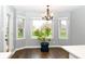 Bright breakfast nook filled with natural light from surrounding windows offering backyard views at 16 Corkwood Ct, Brownsburg, IN 46112