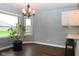 Cozy breakfast nook showcasing backyard view through windows, complemented by an elegant chandelier at 16 Corkwood Ct, Brownsburg, IN 46112