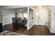 Open-concept dining area with hardwood floors, adjacent to the home's entrance at 16 Corkwood Ct, Brownsburg, IN 46112