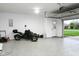 Bright and clean garage with an epoxy floor and an automatic garage door opener at 16 Corkwood Ct, Brownsburg, IN 46112
