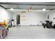 Well-maintained garage with a durable epoxy floor, offering ample space for parking and storage solutions at 16 Corkwood Ct, Brownsburg, IN 46112