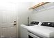 Bright laundry room with modern washer and dryer, offering convenience and efficiency at 16 Corkwood Ct, Brownsburg, IN 46112
