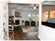 Inviting living room with fireplace, modern furniture, hardwood floors, and natural light at 16 Corkwood Ct, Brownsburg, IN 46112