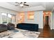 Cozy living room featuring a vaulted ceiling, hardwood floors, and seamless flow to the kitchen at 16 Corkwood Ct, Brownsburg, IN 46112