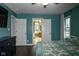 This main bedroom features an open doorway to the bathroom and view outside at 16 Corkwood Ct, Brownsburg, IN 46112