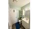 Cozy bathroom with a blue bathmat and ample storage in the built-in cabinet at 2126 Dawnshire Dr, Columbus, IN 47203