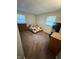 Bedroom with carpet, neutral walls, windows, and a bed and dresser at 2126 Dawnshire Dr, Columbus, IN 47203
