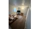 Bedroom with carpet, neutral walls, a bed, dresser and mounted television at 2126 Dawnshire Dr, Columbus, IN 47203