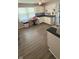 Bright kitchen features white cabinets, sleek black countertops, and modern tiled backsplash at 2126 Dawnshire Dr, Columbus, IN 47203
