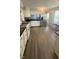Spacious kitchen with stainless steel appliances, white cabinetry, and modern countertops at 2126 Dawnshire Dr, Columbus, IN 47203