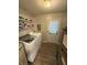 Laundry room with washer, dryer, shelving, linoleum floors, and rear access door at 2126 Dawnshire Dr, Columbus, IN 47203