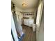 Convenient laundry room equipped with a washer, dryer, and ample shelving at 2126 Dawnshire Dr, Columbus, IN 47203