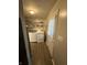 Laundry room with linoleum floors, washer, dryer, storage, and rear exit door at 2126 Dawnshire Dr, Columbus, IN 47203