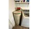 Calligan water softener next to the washing machine ensuring water filtration in your laundry room at 2126 Dawnshire Dr, Columbus, IN 47203