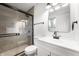 Stylishly renovated bathroom featuring glass shower and modern fixtures at 2200 W Christy Ln, Muncie, IN 47304