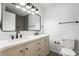 Bright bathroom with double vanity, modern fixtures, large mirror, and neutral color palette at 2200 W Christy Ln, Muncie, IN 47304