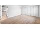 A bedroom featuring neutral carpet, ample closet space, and an ensuite bathroom at 2200 W Christy Ln, Muncie, IN 47304