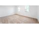 Sunlit bedroom with neutral paint and plush carpeting at 2200 W Christy Ln, Muncie, IN 47304