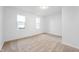 Bright bedroom with neutral carpet and large windows at 2200 W Christy Ln, Muncie, IN 47304