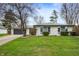 Charming ranch-style home with a stone facade, well-maintained lawn, and attached garage at 2200 W Christy Ln, Muncie, IN 47304