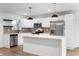Modern kitchen with stainless steel appliances, white cabinetry, and contrasting hardware at 2200 W Christy Ln, Muncie, IN 47304