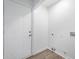 Clean laundry room with white door, vinyl floor, and washer/dryer hookups for easy convenience at 2200 W Christy Ln, Muncie, IN 47304