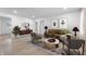 A bright living room with modern furniture, decor, and light wood flooring at 2200 W Christy Ln, Muncie, IN 47304
