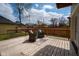 Back deck with seating area and wooden perimeter railing at 2209 Carrollton Ave, Indianapolis, IN 46205