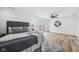 Spacious bedroom featuring a ceiling fan, balcony access, and wood-look flooring at 2209 Carrollton Ave, Indianapolis, IN 46205