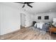 Cozy bedroom featuring a ceiling fan and wood-look flooring at 2209 Carrollton Ave, Indianapolis, IN 46205