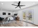 Bedroom with a ceiling fan, and double doors to the balcony at 2209 Carrollton Ave, Indianapolis, IN 46205