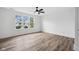 Bright bedroom featuring a ceiling fan and large windows at 2209 Carrollton Ave, Indianapolis, IN 46205