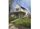 Beautiful two-story home with a welcoming front porch and freshly landscaped yard at 2209 Carrollton Ave, Indianapolis, IN 46205