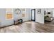 Bright foyer with wood floors, bench seating, and a stylish front door at 2209 Carrollton Ave, Indianapolis, IN 46205