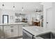 Open-concept kitchen with island, dining area, and views to living room at 2209 Carrollton Ave, Indianapolis, IN 46205