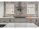 Gourmet kitchen with gas range, tile backsplash, and ample counter space at 2209 Carrollton Ave, Indianapolis, IN 46205