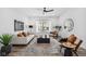 Spacious living room with modern furniture, luxury vinyl plank flooring and lots of natural light at 2209 Carrollton Ave, Indianapolis, IN 46205