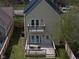 This home boasts a rear wooden deck and second floor balcony that adds additional outdoor living space at 2209 Carrollton Ave, Indianapolis, IN 46205