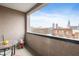 Cityscape views from the balcony with small outdoor table and chairs at 225 N New Jersey St # Apt 48, Indianapolis, IN 46204