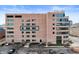 Rear building view highlighting parking, greenery, and architectural details at 225 N New Jersey St # Apt 48, Indianapolis, IN 46204