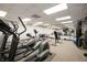 Spacious gym area with modern equipment, mirrors, and a full range of exercise options at 225 N New Jersey St # Apt 48, Indianapolis, IN 46204