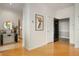 Bright hallway with wood flooring and elegant decor at 225 N New Jersey St # Apt 48, Indianapolis, IN 46204