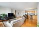 Bright and open living room flowing into the kitchen, hardwood floors, and comfortable seating at 225 N New Jersey St # Apt 48, Indianapolis, IN 46204
