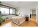Bright bedroom with large window and hardwood floors at 225 N New Jersey St # Apt 48, Indianapolis, IN 46204