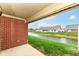Scenic view from the back porch overlooking the well-maintained lawn and tranquil water feature at 229 Waterford Ct, Avon, IN 46123