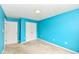 Inviting bedroom with calming blue walls, carpet, and a closet; waiting for your personal touch at 229 Waterford Ct, Avon, IN 46123