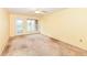 Bright, spacious bedroom featuring carpet floors, fan, and a door leading to the outside at 229 Waterford Ct, Avon, IN 46123