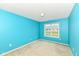 Calming bedroom featuring blue walls, plush carpet, and an ample window overlooking a serene landscape at 229 Waterford Ct, Avon, IN 46123