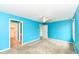 Open-concept bedroom featuring an illuminated ceiling fan and bright blue walls providing a comfortable atmosphere at 229 Waterford Ct, Avon, IN 46123